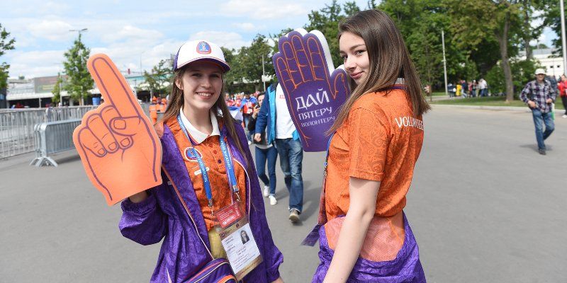 High five, por favor, arigato: World Cup volunteers discuss their work and city guests